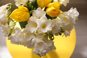 Beautiful bouquet with fresh freesia flowers on blurred background, closeup
