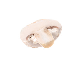 Piece of fresh champignon mushroom isolated on white