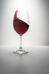 red wine splash in glass