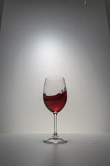 red wine splash in glass