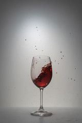 red wine splash in glass