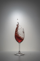 red wine splash in glass