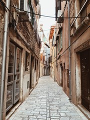 Fototapeta premium Narrow street of Rovinj, Istria region, Croatia, Europe 2019. Old town with vintage buildings. Empty street. Travel concept.