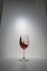 red wine splash in glass