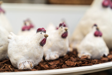 Porcelain and ceramic Easter decorations in a garden center.