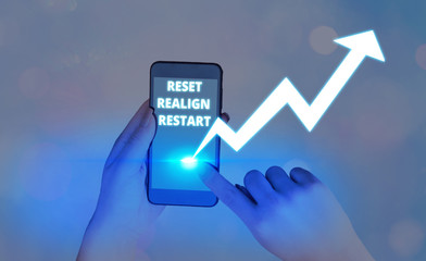 Writing note showing Reset Realign Restart. Business concept for Life audit will help you put...