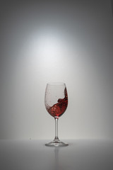 red wine splash in glass