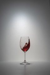 red wine splash in glass