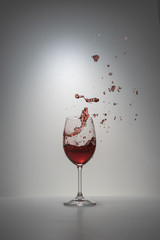 red wine splash in glass