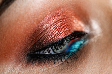 Fototapeta na wymiar Pink eye makeup in macro shot. Perfect shading. Creative makeup