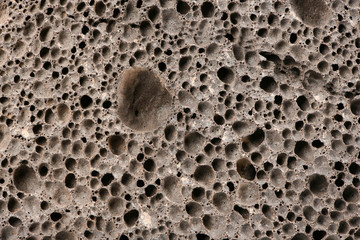 Surface of brown pumice - closeup. Pumice brown sponge texture for body wash.