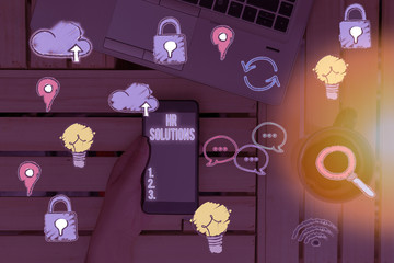 Conceptual hand writing showing Hr Solutions. Concept meaning all the technology businesses use to...