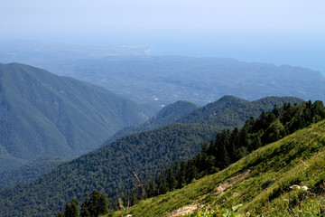 Summer landscape in the mountains and dark blue sky with clouds