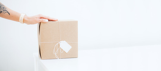 The girl put her hand on a stylish craft box