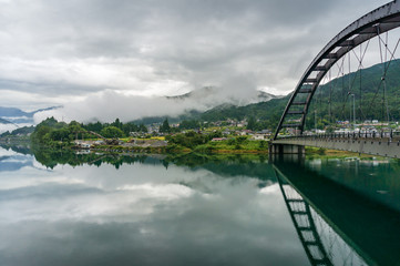 Bridge steel frame with asphalt road. Bridge in Japanese countryside