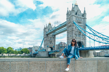 guy on city trip in London, youn men at waterfront by the river Thames at the famous places in...
