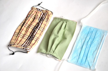 Three surgical masks on white background