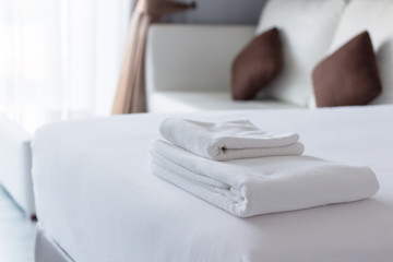 Fototapeta na wymiar White towel on bed