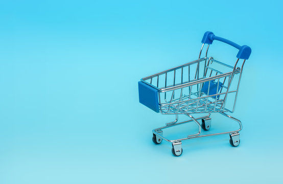 Empty shopping basket on a blue background.Shopping, shopping online concept.Сopy space.