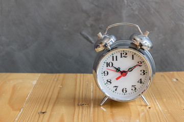 Alarm clock on wooden table
