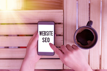 Handwriting text Website Seo. Conceptual photo tactics used to increase the amount of visitors to a...