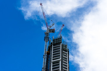 Fototapeta premium Construction of highrise building. Modern skyscraper architecture