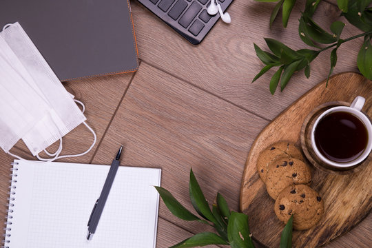 creative home work space - work from home concept in coronavirus quarantine with mediccal protection mask