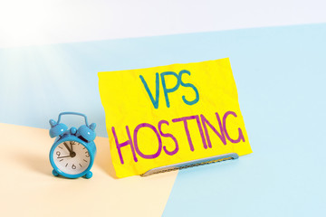 Handwriting text Vps Hosting. Conceptual photo mimics a dedicated server within a shared hosting environment Mini size alarm clock beside a Paper sheet placed tilted on pastel backdrop