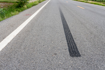 Tire print on asphalt road