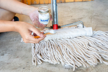 Baking soda with mop for floor cleaning