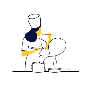 Joven cocinera trabajando. Chef huele la comida que est&aacute; preparando.