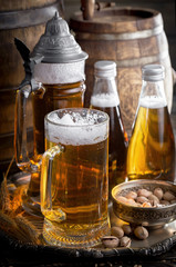 Light beer in a glass, on an old background.