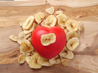 Dried banana and red heart, concept healthy food for heart.