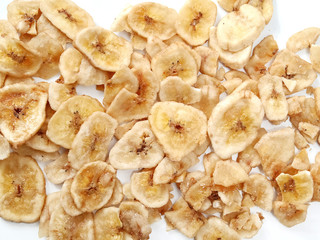 Dried banana chips on a white background