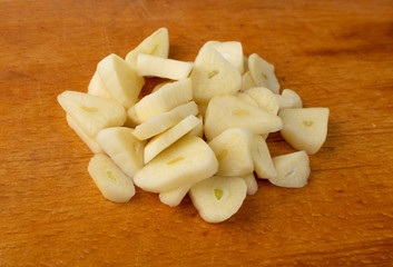 Fototapeta na wymiar Fresh Garlic Parts Isolated on White Background