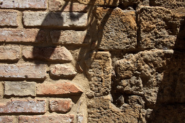 Volterra (SI), Italy - April 25, 2017: A typical tuscany brick wall in Volterra town, Tuscany, Italy