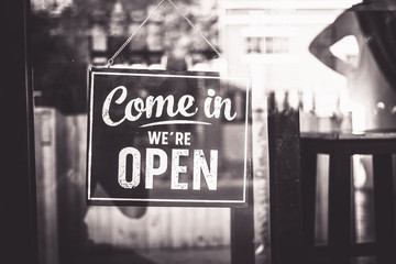 Come in we're open, vintage black retro sign,mono tone