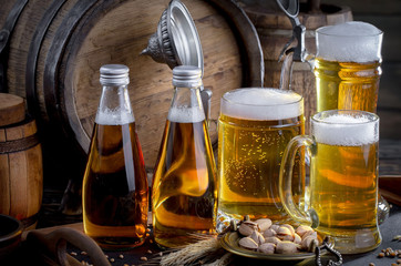 Light beer in a glass on a table in composition with accessories on an old background