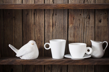 white kitchen dishware on old dark wooden background