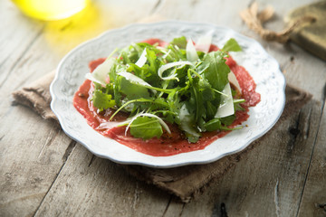 Beef carpaccio with arugula and Parmesan cheese
