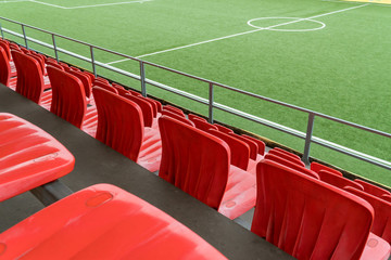 Empty rows with red  seats on a football stadium © Volodymyr Herasymov
