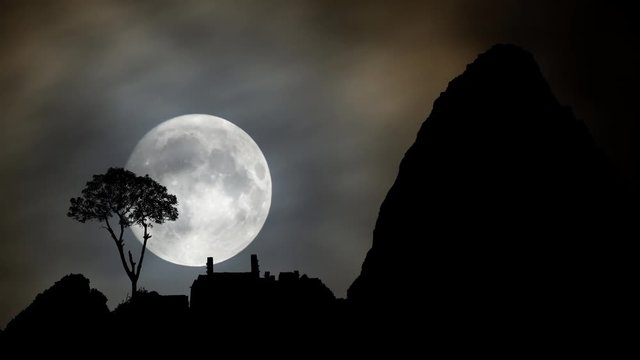 Inca City Machu Picchu and Huayna Picchu Mountain in Silhouette, Time Lapse by Night with Full Moon, Peru
