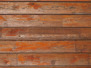 Red background painted on old wood