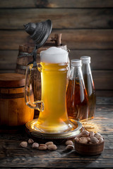 Light beer in a glass, on an old background.