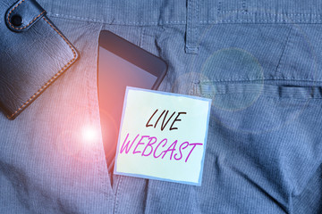 Text sign showing Live Webcast. Business photo text the process of video broadcasting live over the internet Smartphone device inside trousers front pocket with wallet and note paper