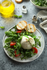 Homemade burrata cheese salad with tomatoes