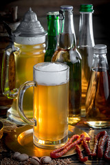 Light beer in a glass, on an old background.