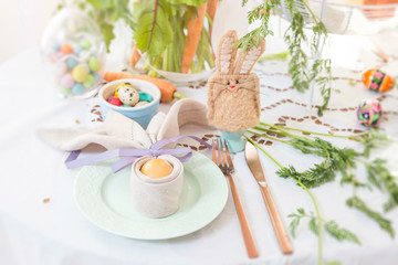 Polish Easter table close up detail. Easter food in Poland. Hand made bunny egg cosy.