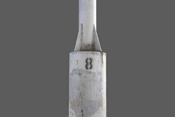 solated.Iron pole with the number 8 on a gray background.