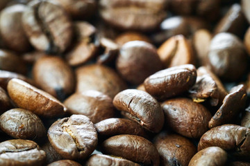 brown coffee grains close-up with blurry background